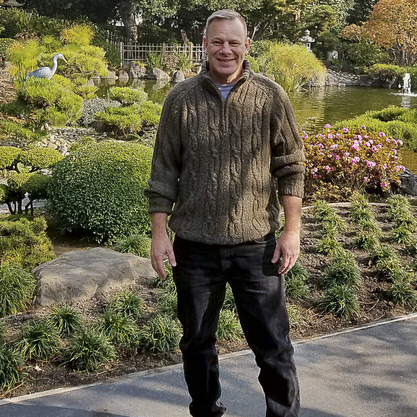 Game design student Richard Mulliner standing outdoors.