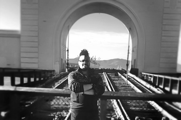 Black and white photo featuring Industrial Design student George Gray center.