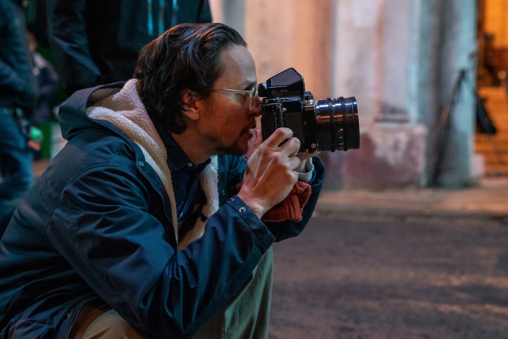 Director Cary Joji Fukunaga on the set of NO TIME TO DIE.