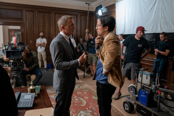 Main image of actor Daniel Craig and director Cary Joji Fukunaga on the set of "NoTime To Die."